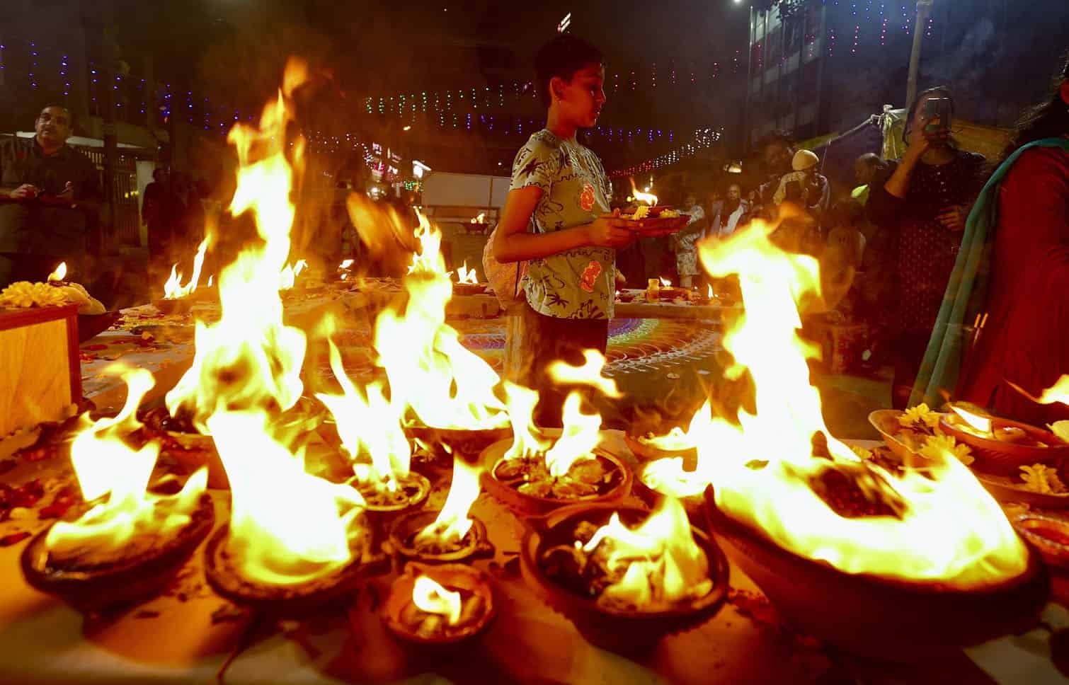 Hindu devotees light lamps to mark auspicious end of Karthika month