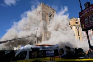 Dust rises from the second collapse of part of the medieval tower "Torre dei Conti"