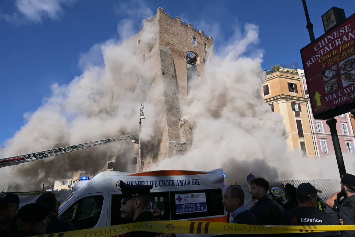 Dust rises from the second collapse of part of the medieval tower "Torre dei Conti"