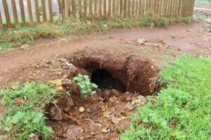 The sinkhole is now stretching to under the fence separating Khutsong South and the big storm water canal next to it.