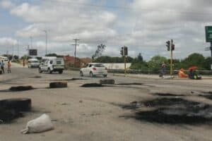 Luphisa road barricaded by burning tires during Ntlemo Projects workers’ strike in October.