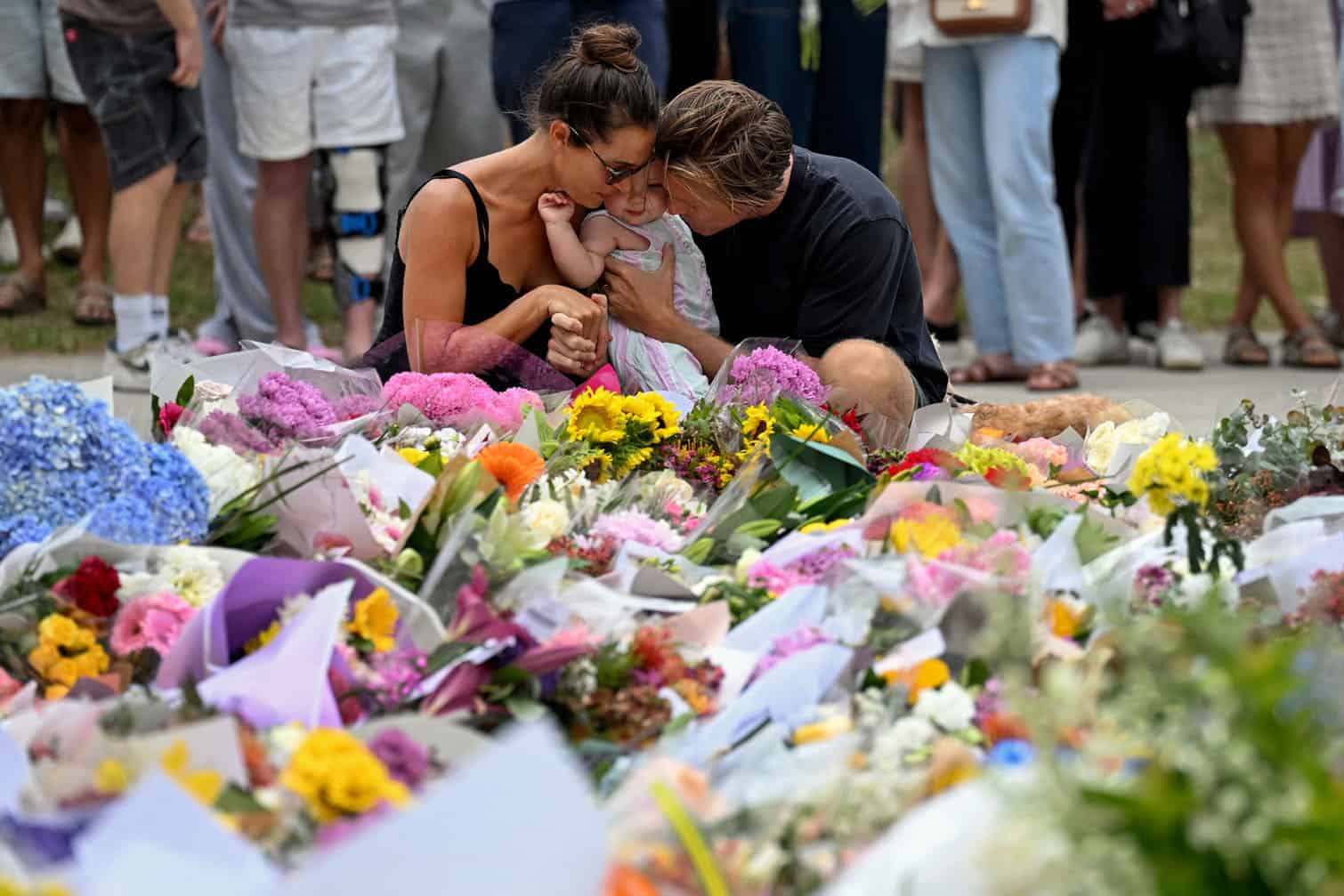 Mourners pay a floral tribute to Bondi Beach