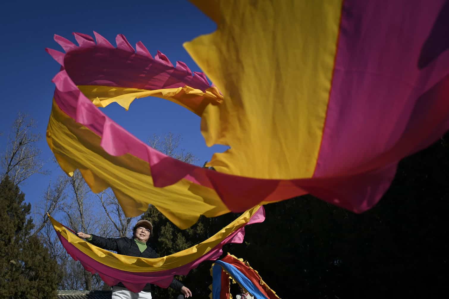 A woman dances with ribbons