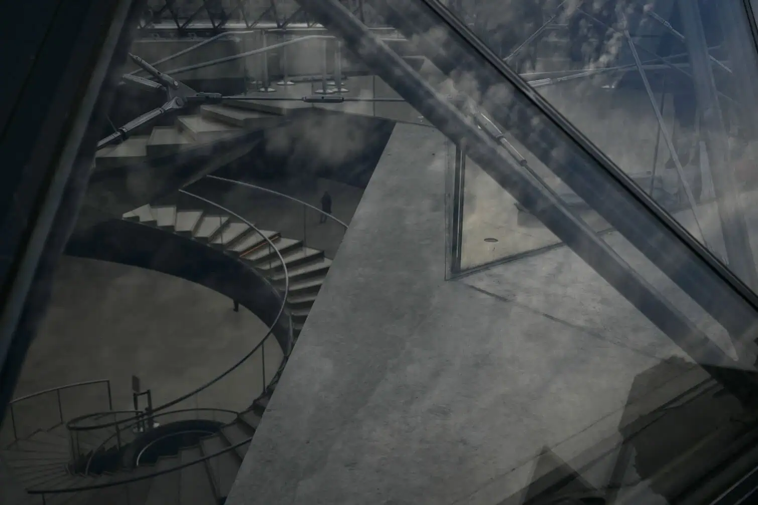 This photograph shows a solitary figure in the foyer of the Louvre