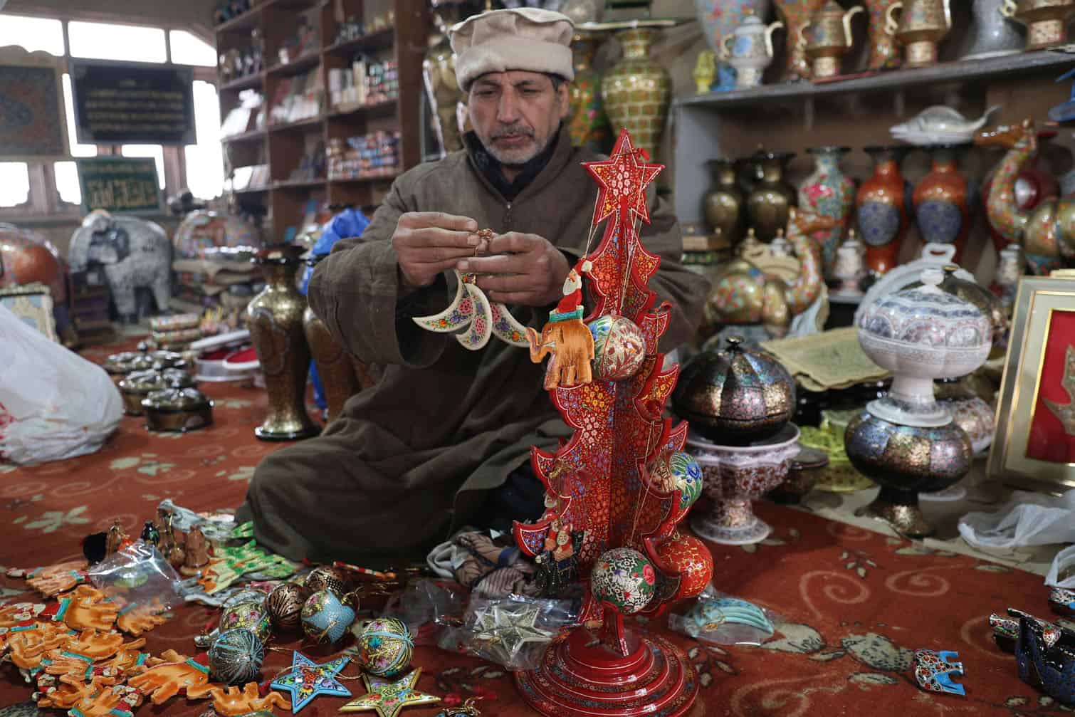 Artisans craft papier mache Christmas decorations ahead of Christmas