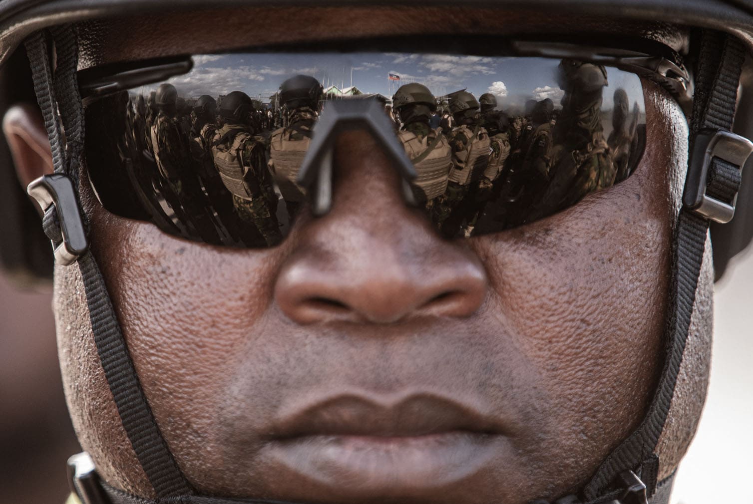 Kenyan police officers are reflected