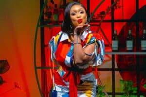 Minnie Dlamini blowing a kiss on camera