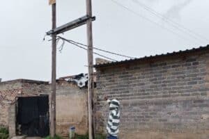 Resident Mike Maake points to where a transformer was removed.