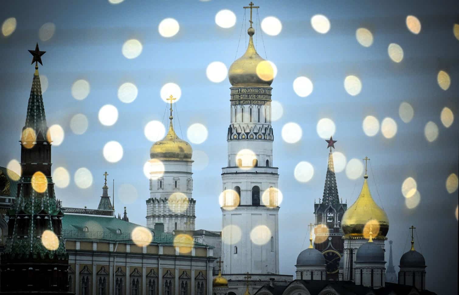 The Kremlin is seen through Christmas decorations