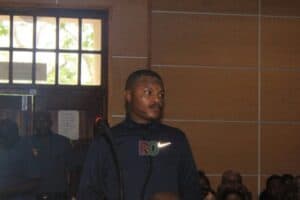 Members of the public and media gather in court as the investigating officer opposes bail for Shebeshxt.