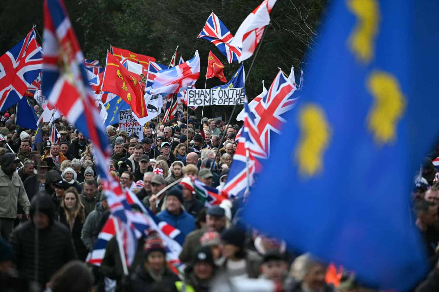 A march of protesters waving flags