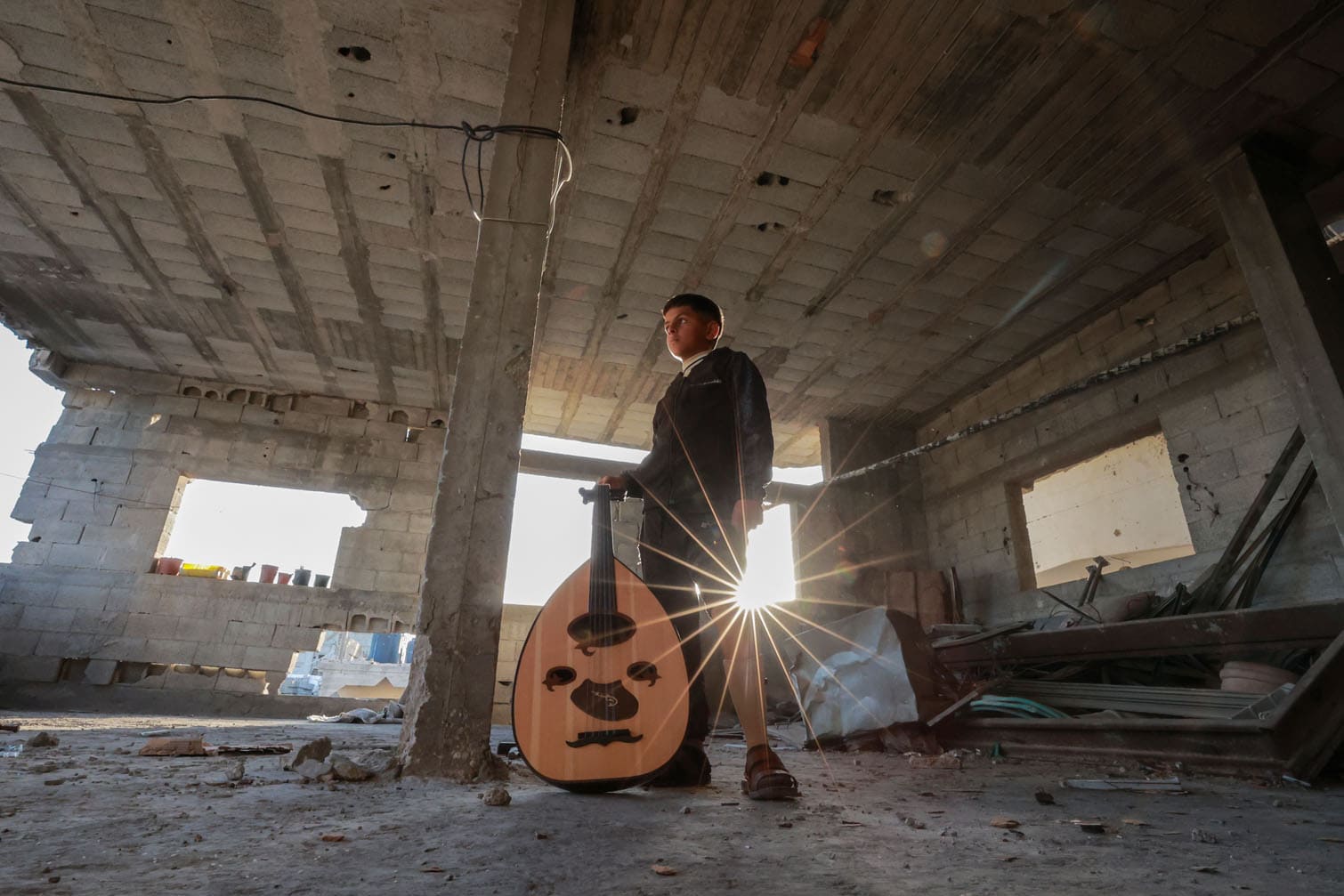 12-year-old Palestinian boy holds onto life with music