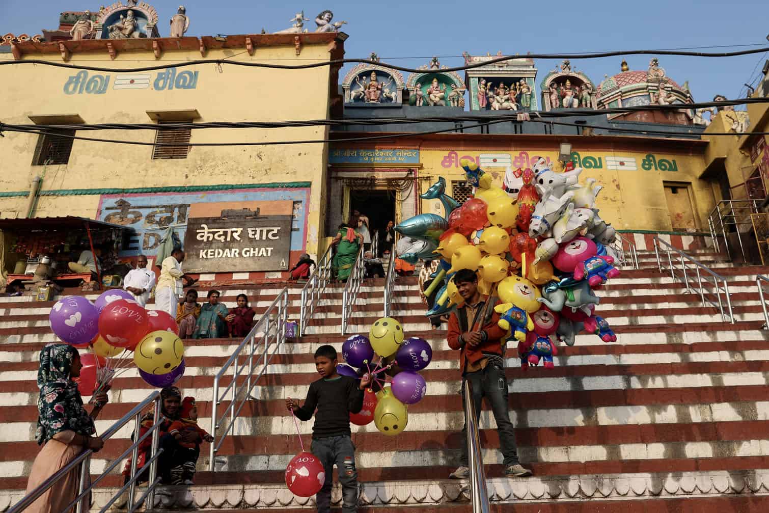 Balloon sellers wait for customers
