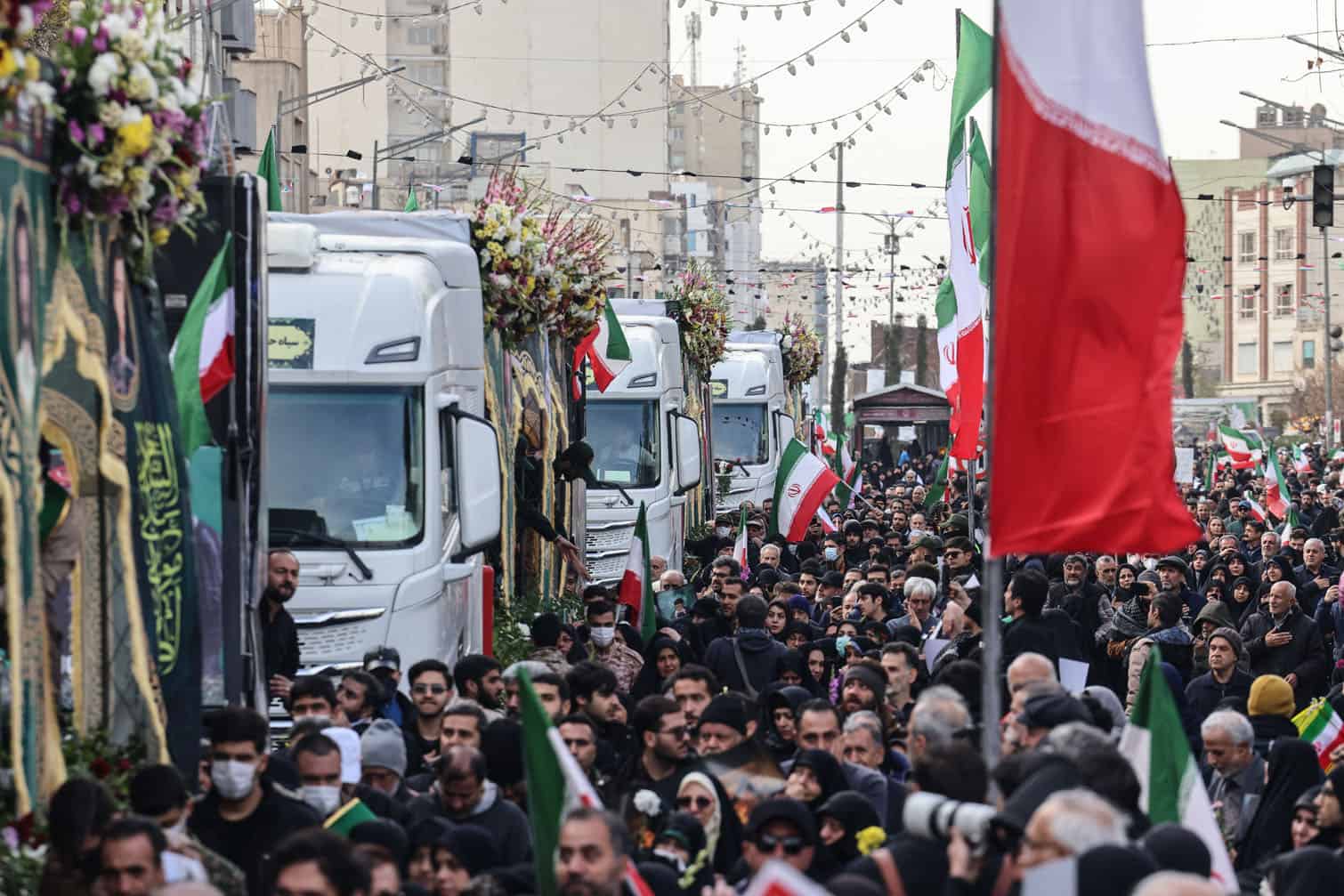 Iranians attend the funerals of security forces personnel killed in recent protests