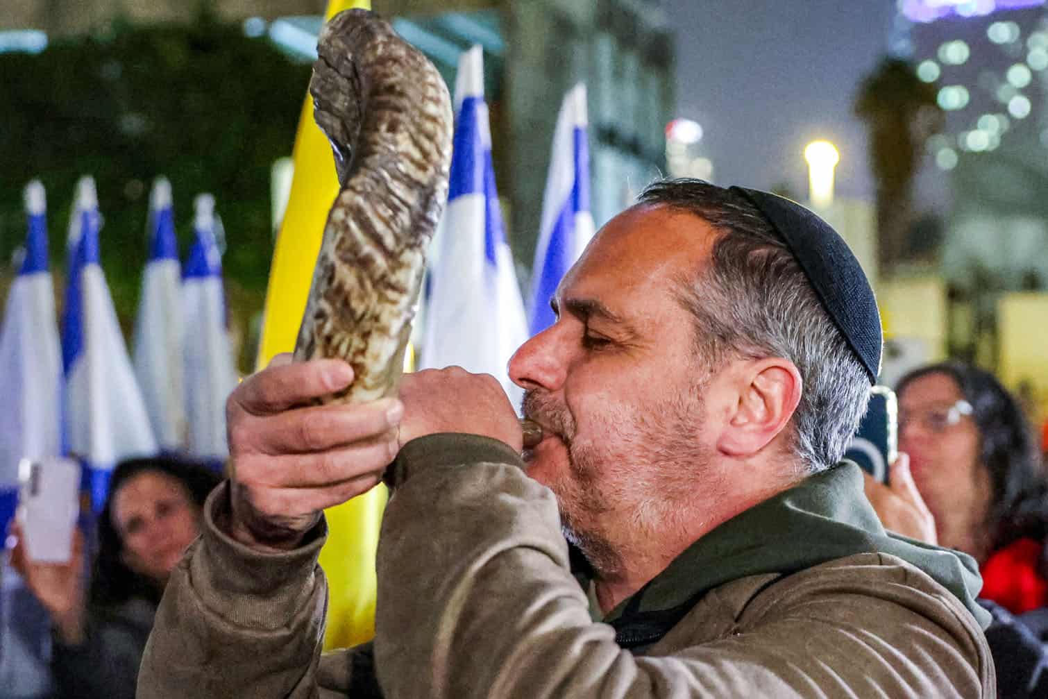 A man blows a shofar