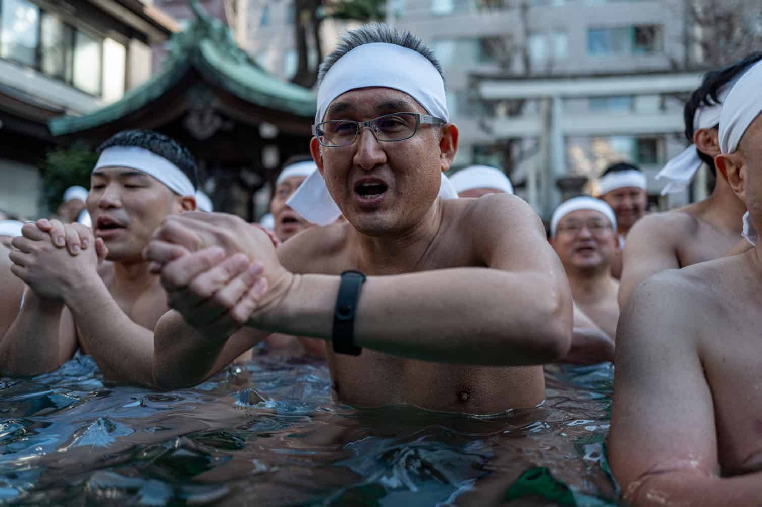 Participants take a bath in cold water