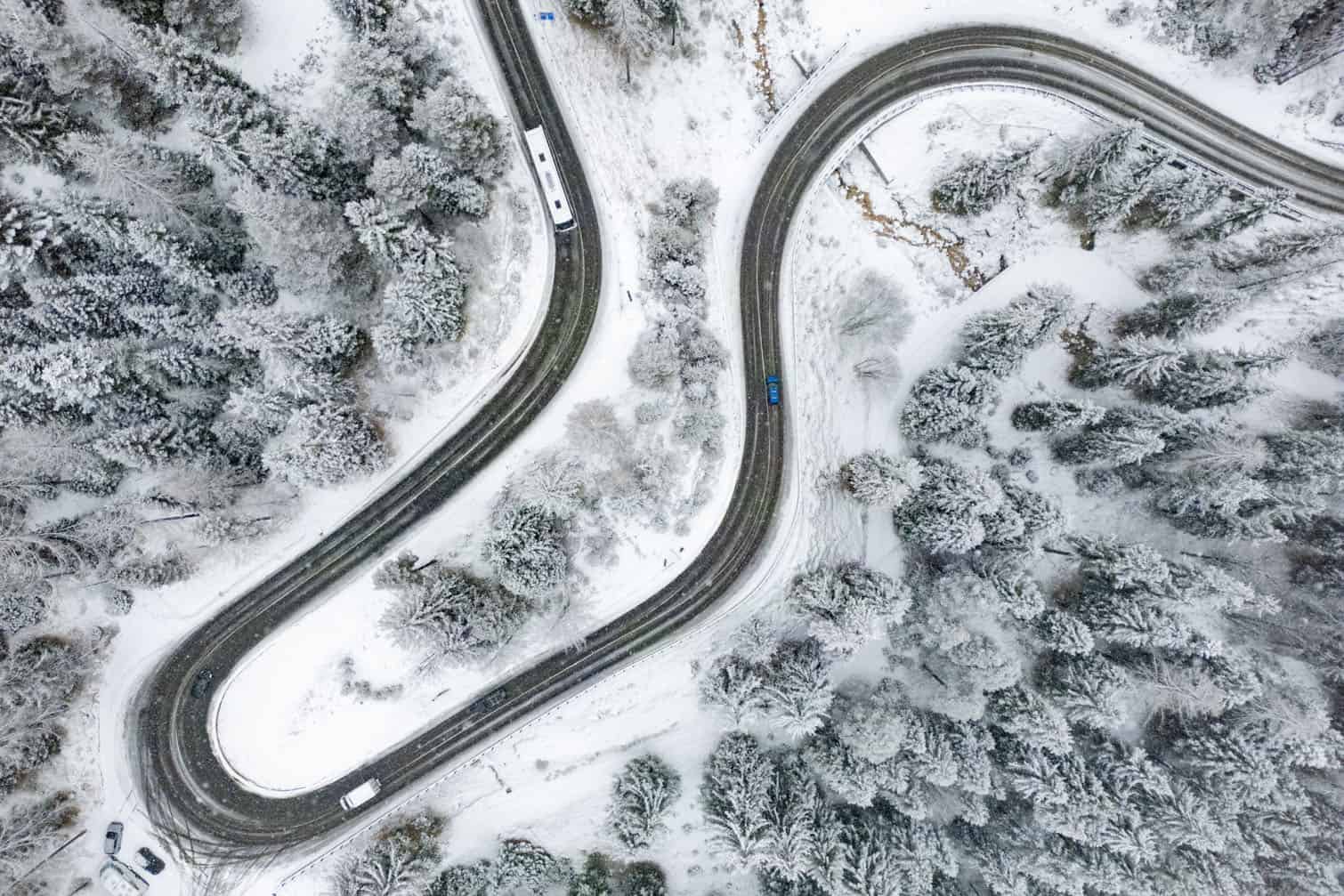 Cars make their way along a mountain road outside Cortina