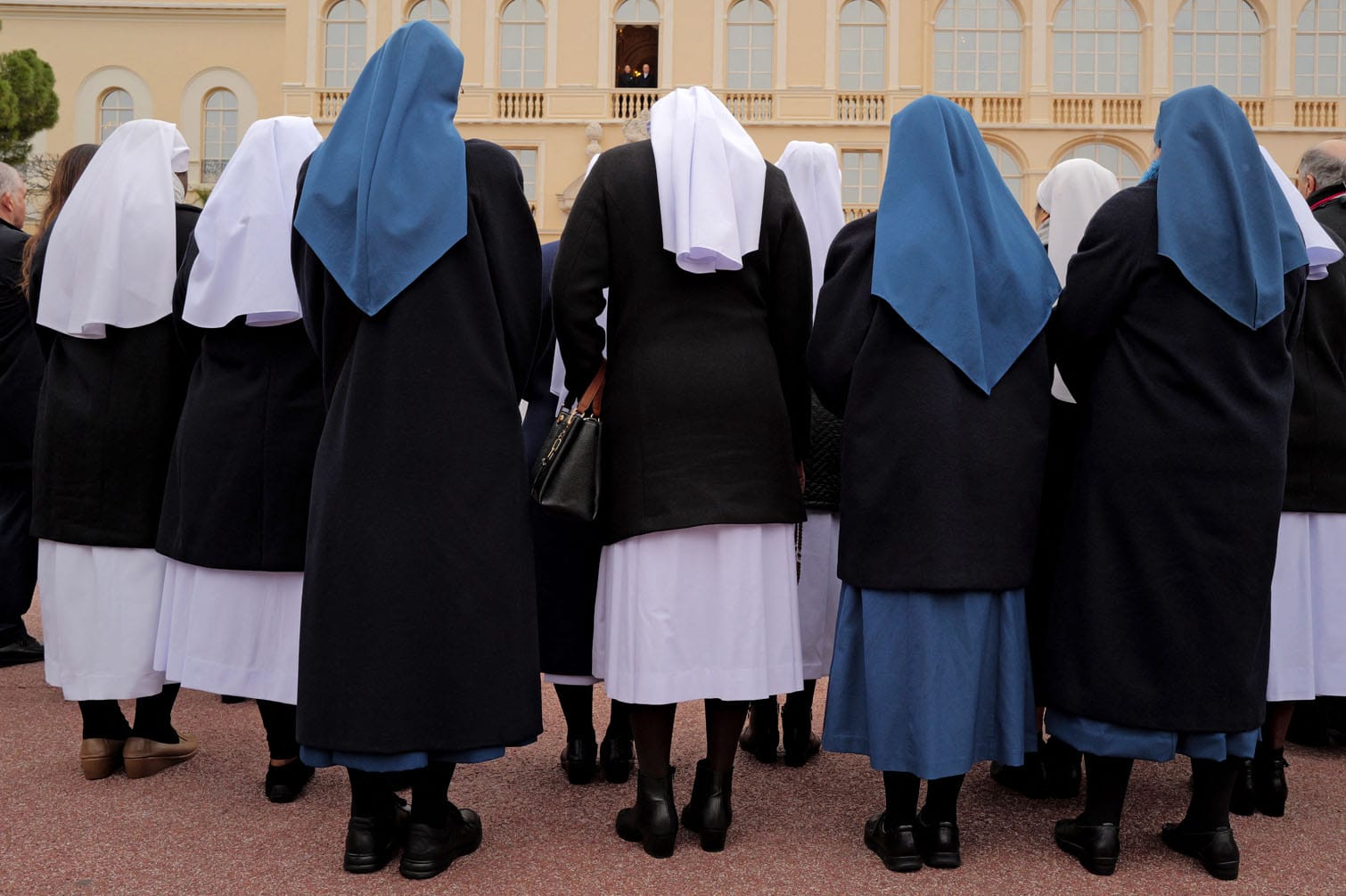 Nuns stand in front of Prince Albert II of Monaco
