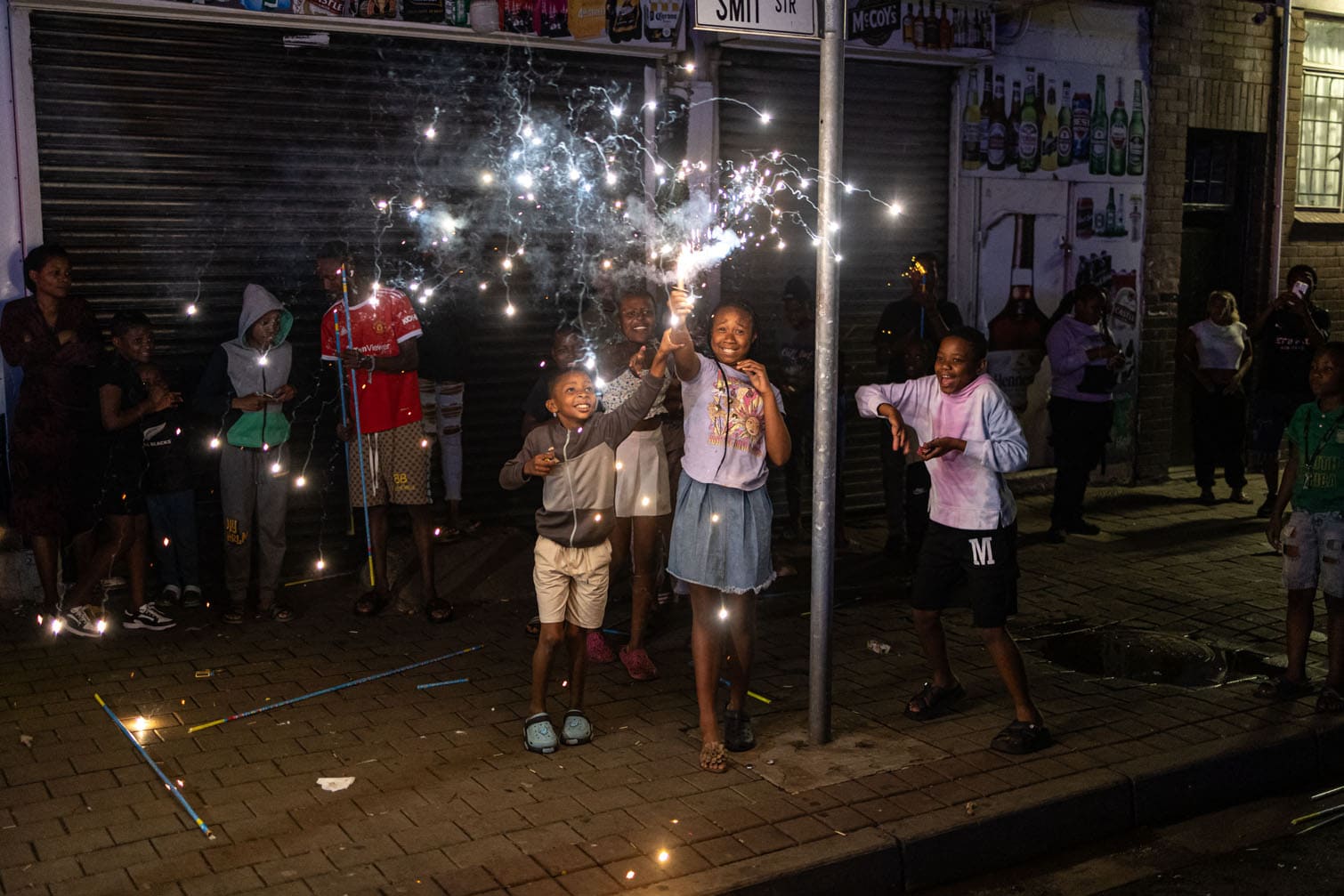 Children set off fireworks as they celebrate New Year in Hillbrow