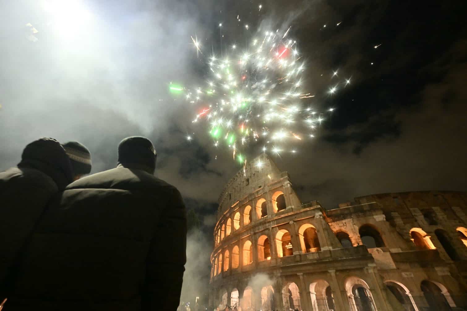 Fireworks explode over the Colosseum in central Rome