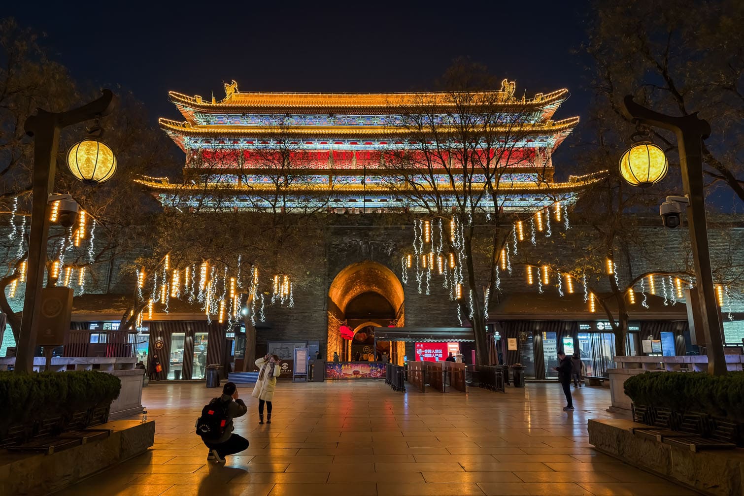 Visitors Take Photos in Front of Yongning Gate in Xi'an at Night