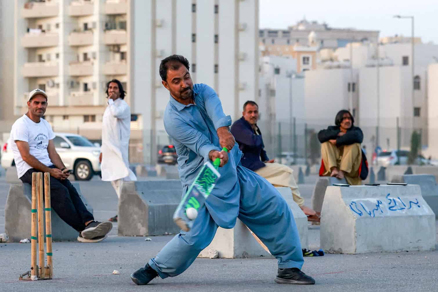 Members of Qatar's Pakistani community play cricket