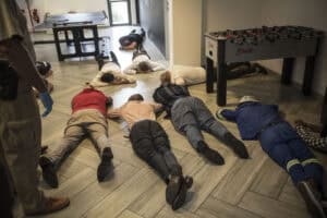 A multi-agency task team, lead by the Hawks, raids one of seven locations