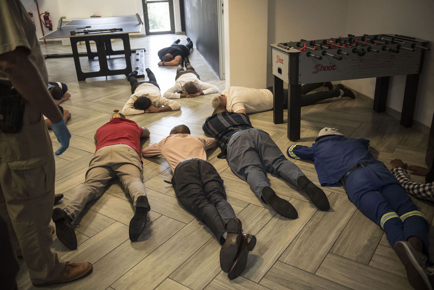 A multi-agency task team, lead by the Hawks, raids one of seven locations