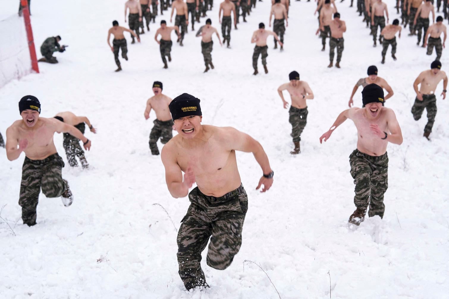 South Korean Marines running on a snowy hill
