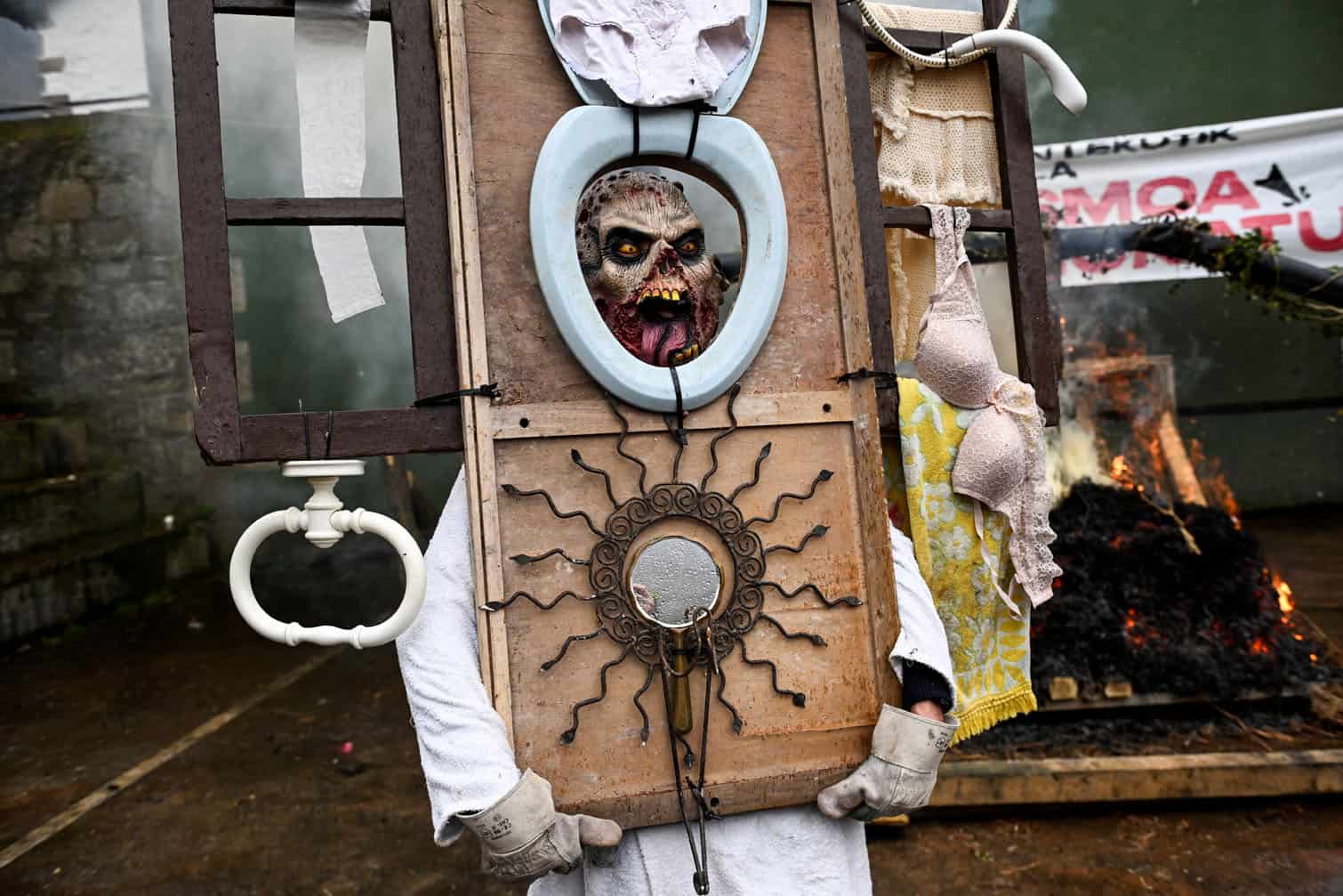 A masked reveller takes part in the traditional carnival of Ituren