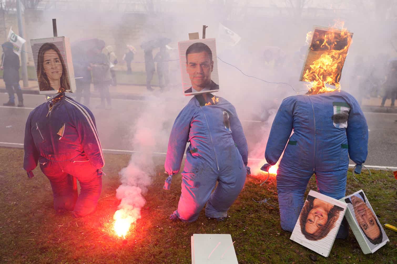 Straw-stuffed dolls with photographs of Spanish Prime Minister Pedro Sanchez