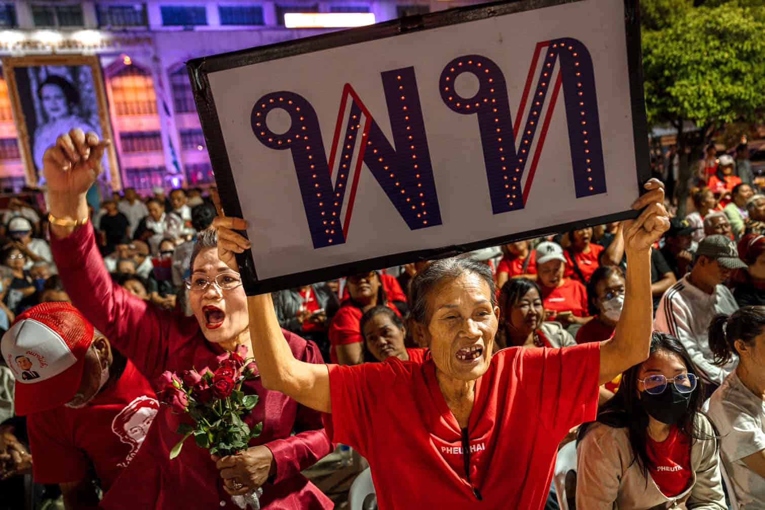 Supporters cheer at the Pheu Thai Party