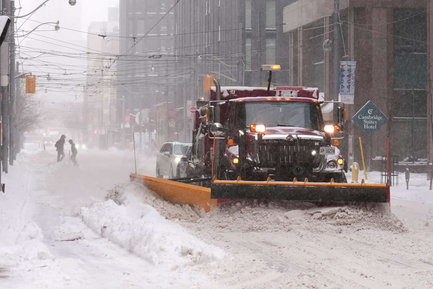 A snowplow makes its way along the road