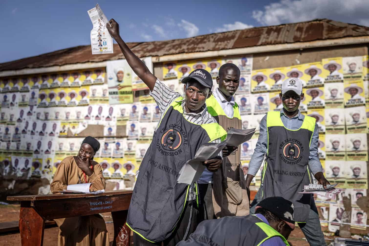 A polling assistant from Uganda’s Electoral Commission counts votes
