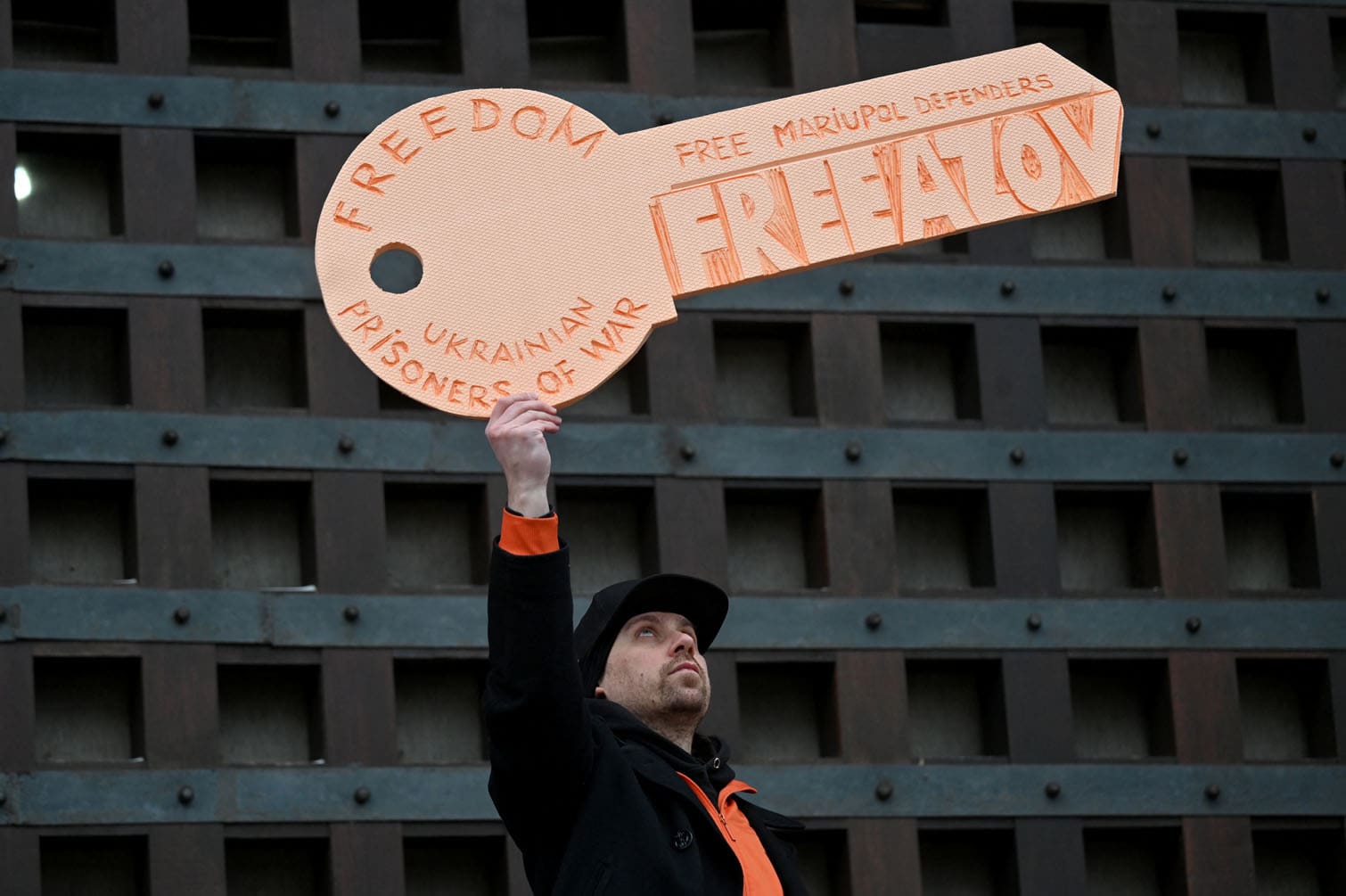 A man holds a symbolic key of freedom