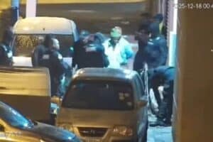 The assault victim was allegedly handed over to police and the officers suspended.