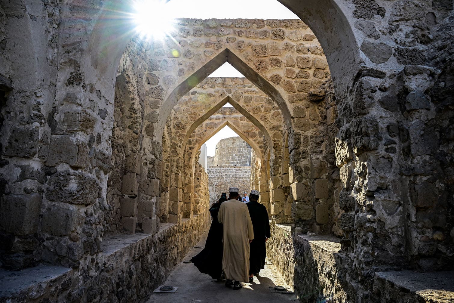 Visitors tour through Qalaat al-Bahrain