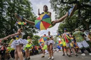 Revelers take part in the Galo da Madrugada (Dawn Rooster) street carnival