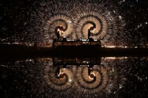 Men perform molten iron fireworks
