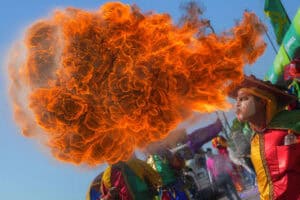 A reveler performs during the Batalla de Flores