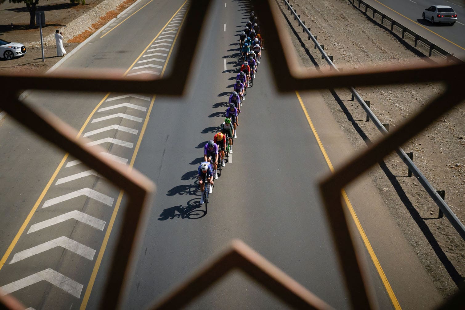 The pack rides during the 4th stage of the Tour of Oman cycling race