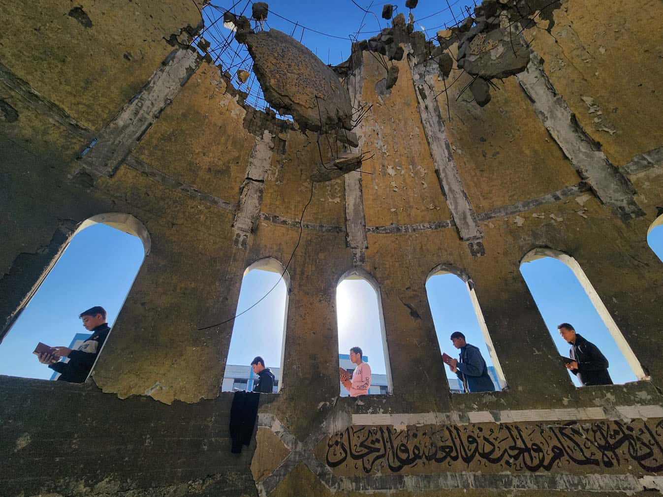 Palestinian children read Quran at destroyed mosque in Gaza during Ramadan