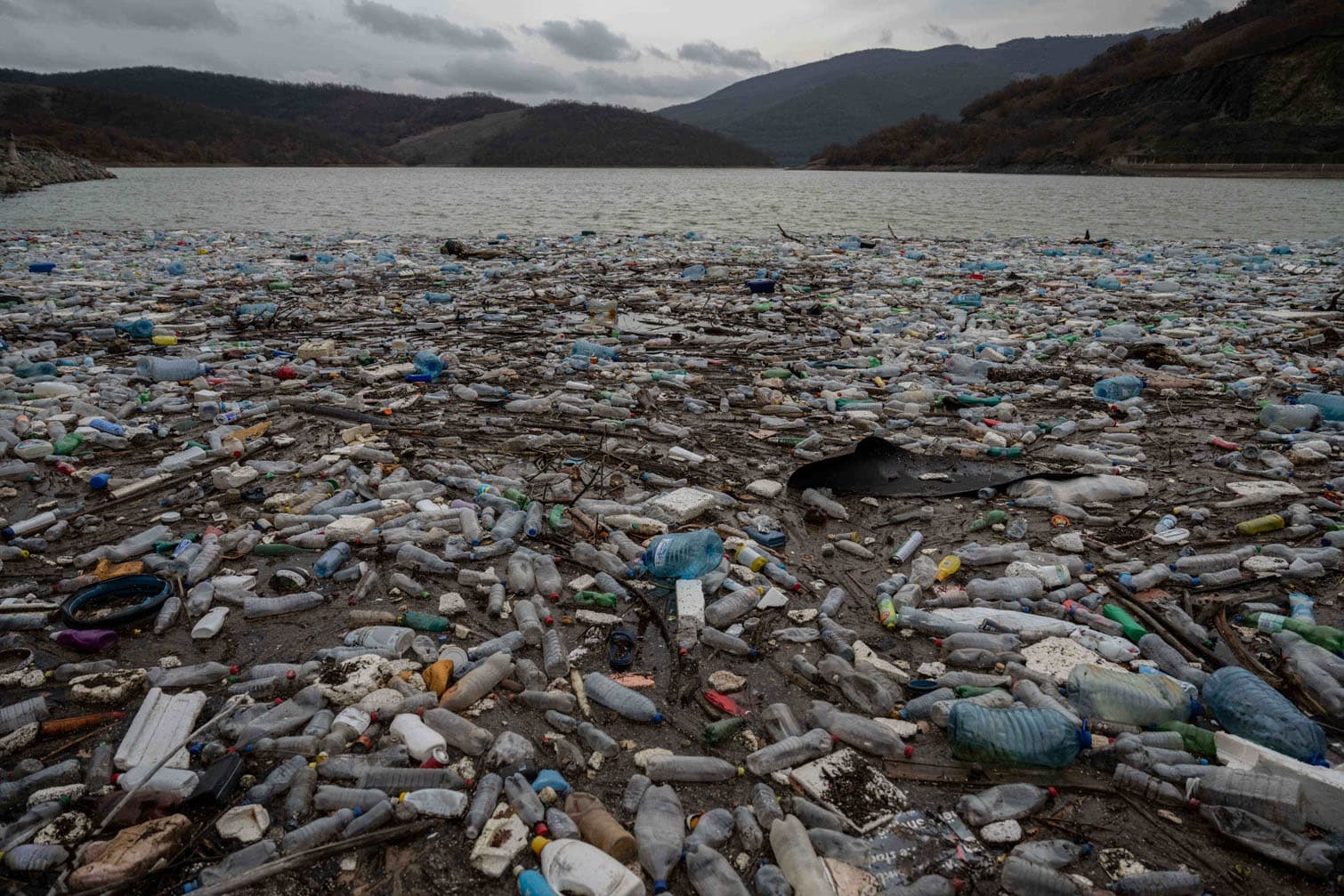 dumped plastic bottles and other garbage washed away by rains
