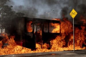 A bus set on fire by organised crime groups