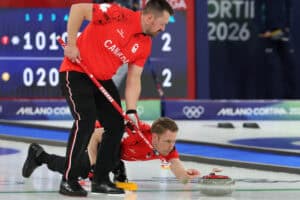 Two men curling at Winter Olympics Canada cheating