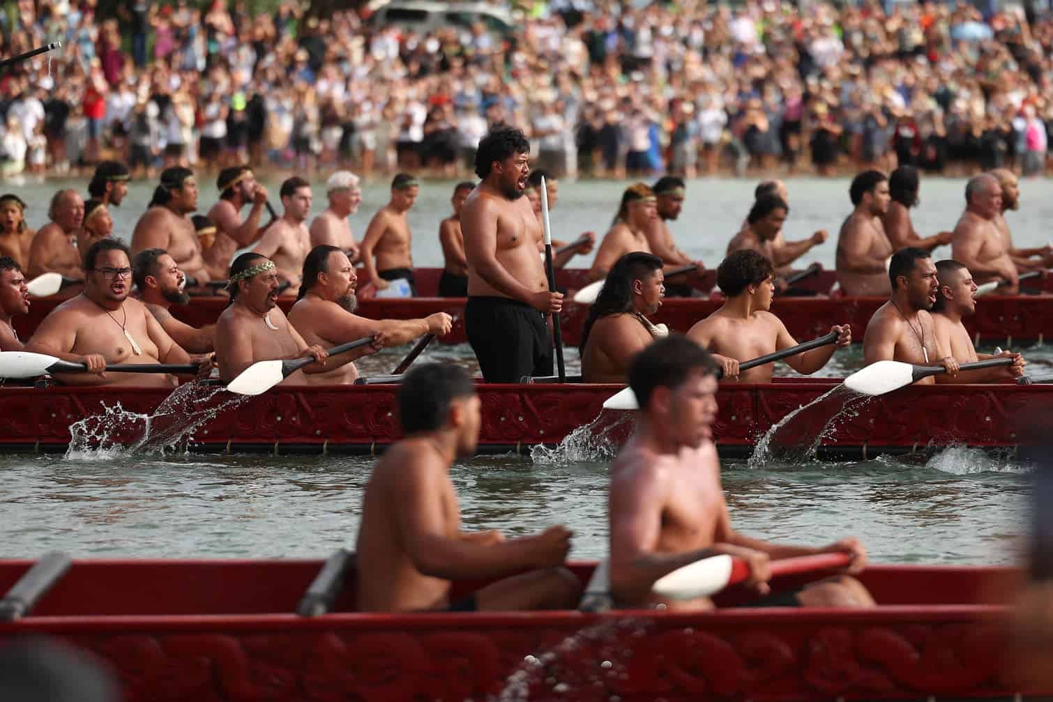 Participants paddle their boats during a waka ceremony