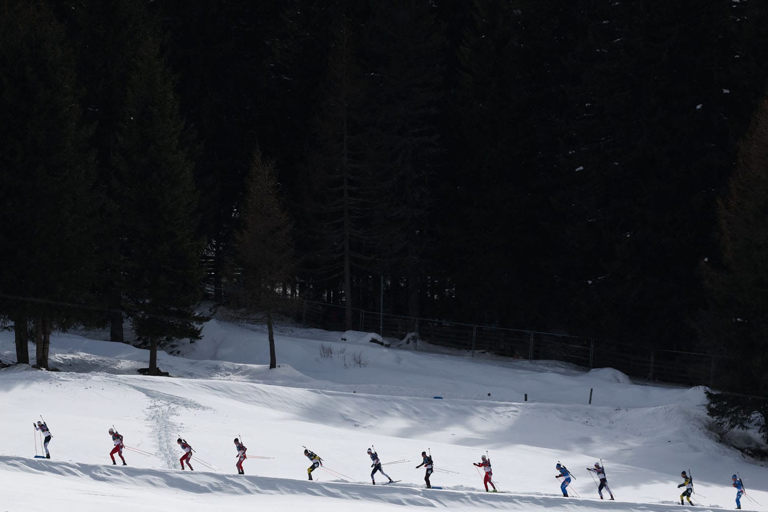 Athletes compete during the men's biathlon 15km