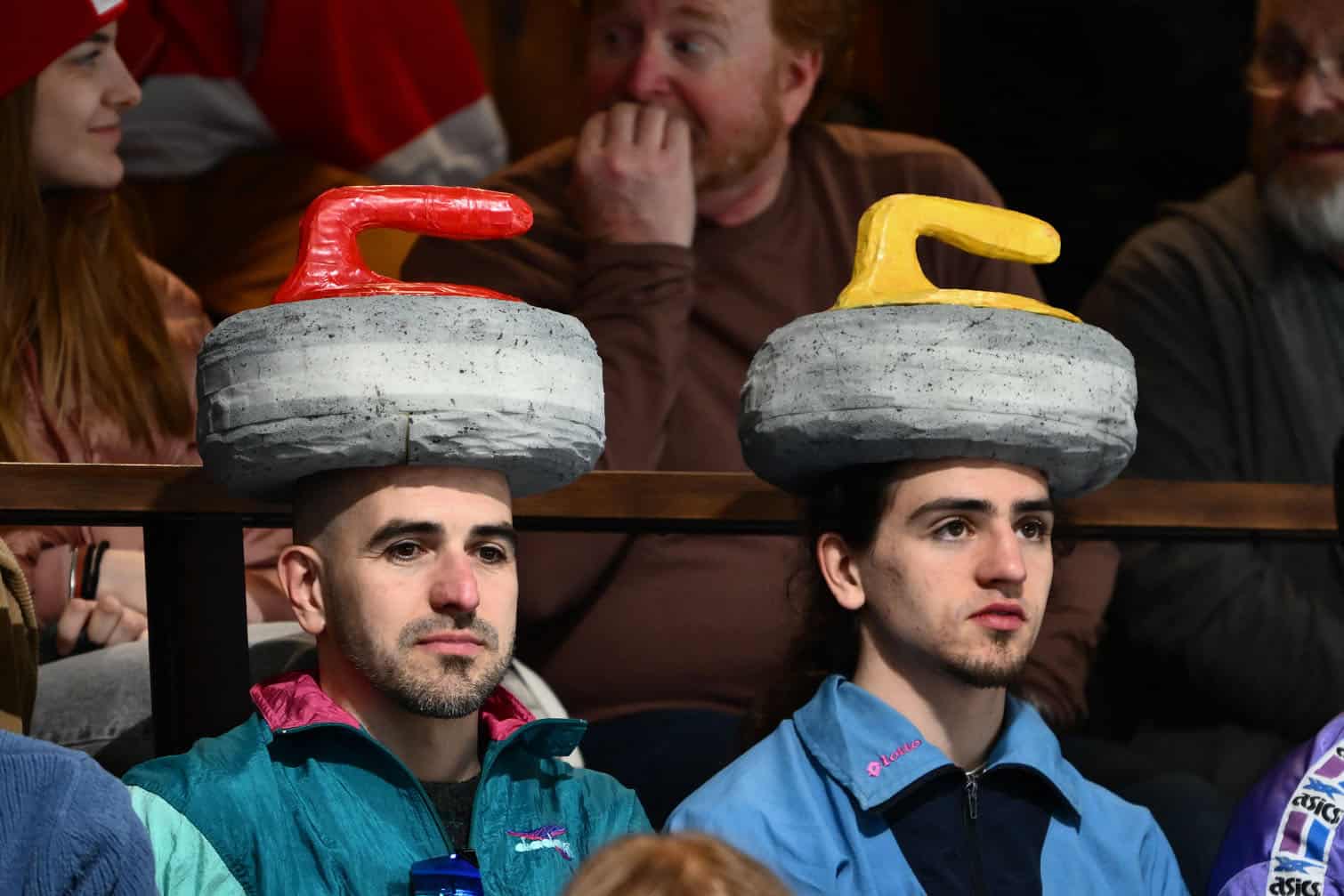 Fans wearing Curling stone hats