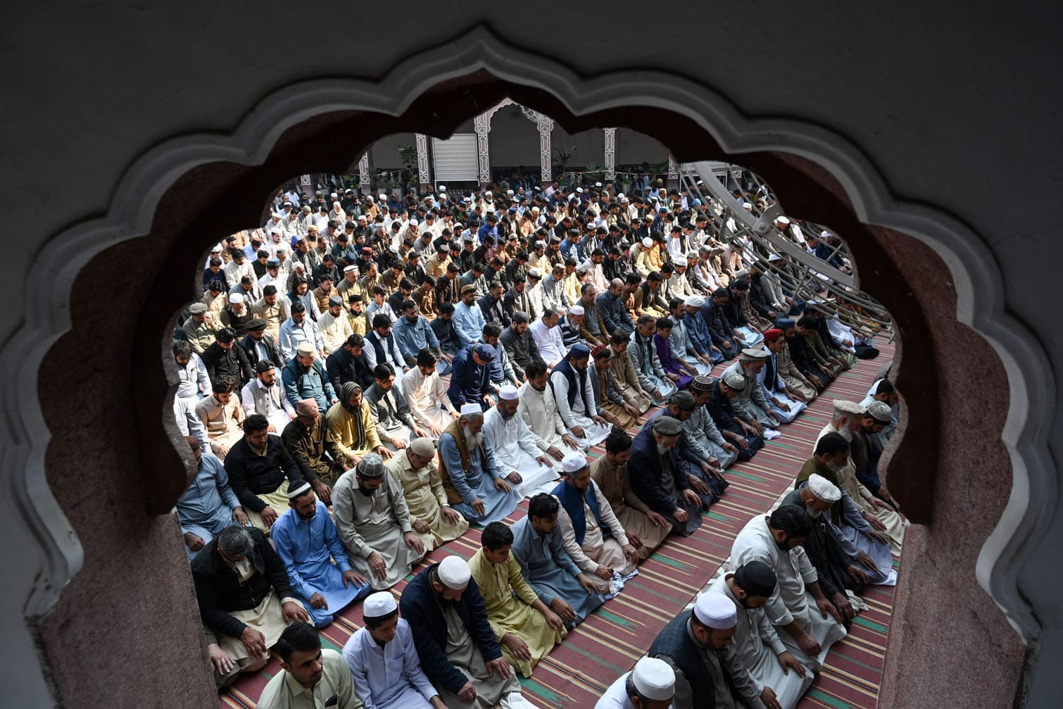 Muslim devotees offer their first Friday prayers
