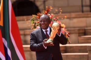 President Cyril Ramaphosa poses for a picture with the FIFA World Cup trophy